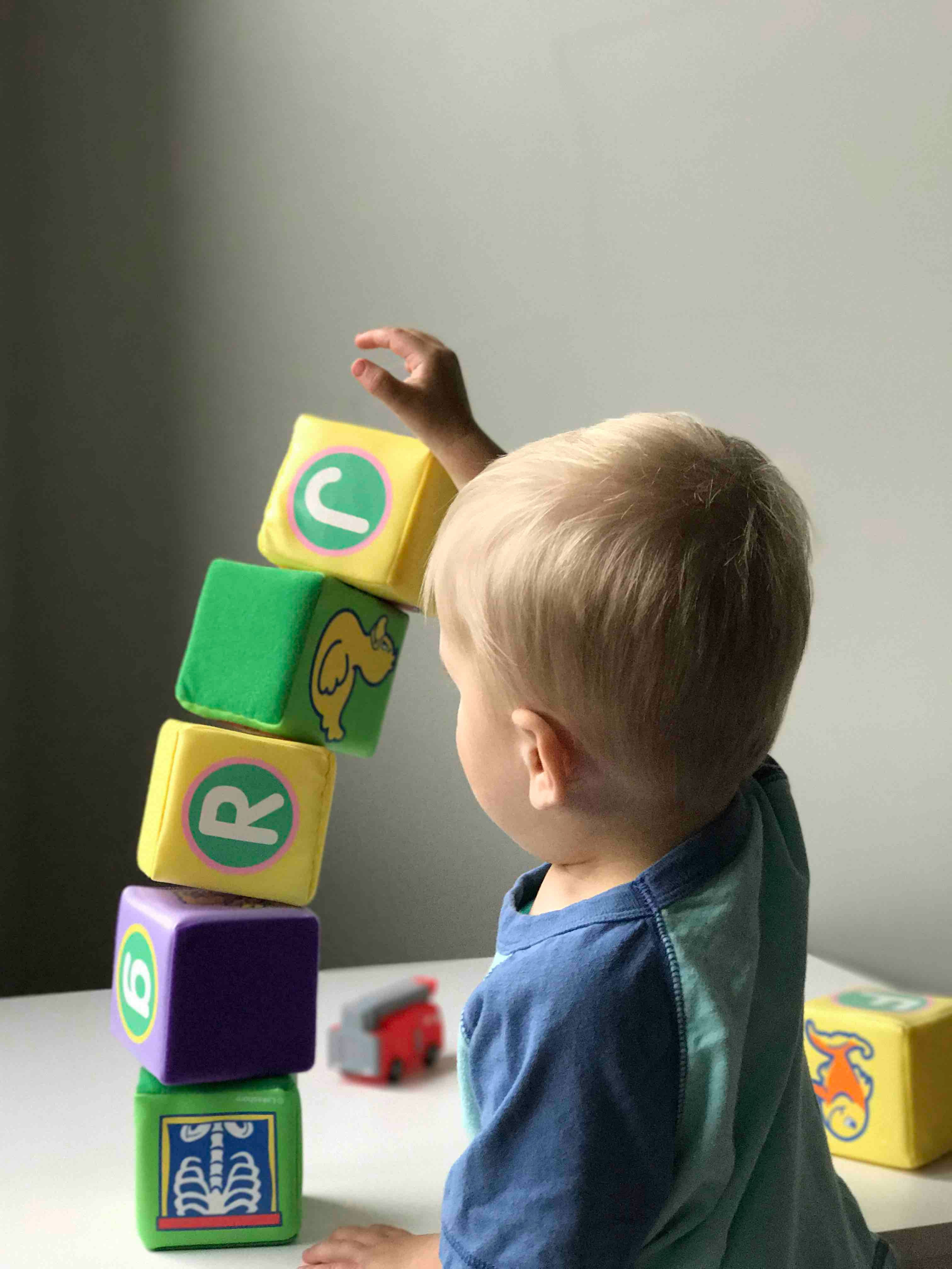 boy playing with building blocks